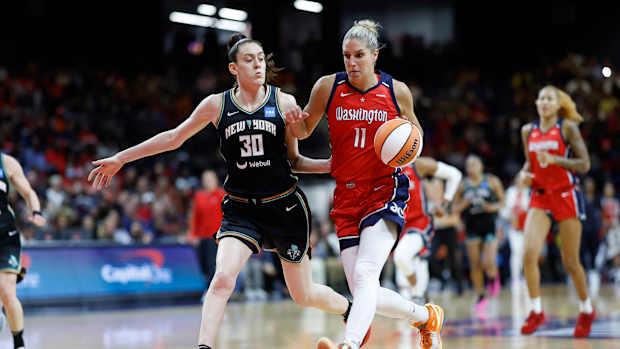 Washington Mystics forward Elena Delle Donne dribbles past New York Liberty forward Breanna Stewart.